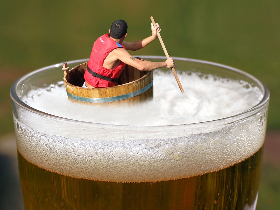image – man floating in beer